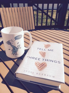 writing across age bands, author Julie Buxbaum's young adult novel Tell Me Three Things on a table outside