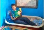 Not every bookstore has a bathtub filled with pillows for reading in!  Here Lisa Yee & friend enjoy this Hickabee's feature