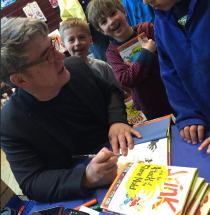 Peter signs Stink and the Attack of the Slime Mold for fans